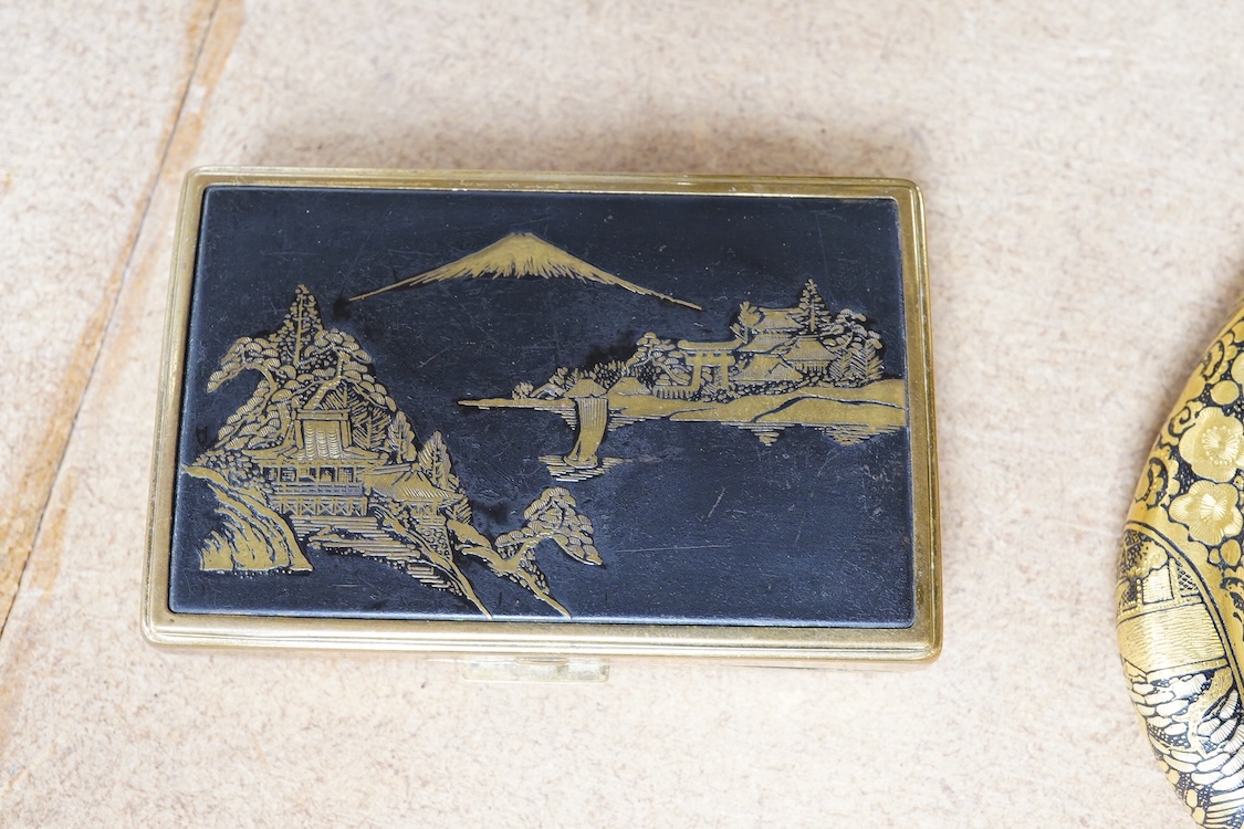 A Japanese damascened iron parasol handle, a cloisonné enamel koro and Komai style mirrored musical compact, largest 24cm in length